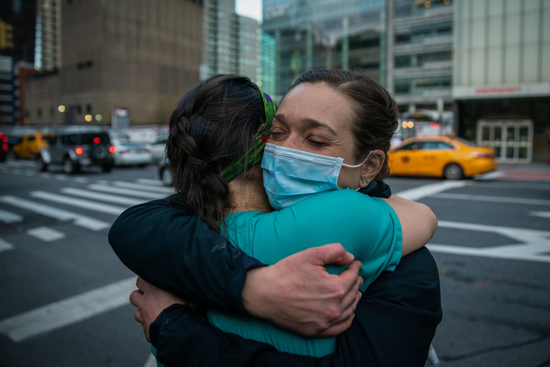 Medical workers embrace, New York.