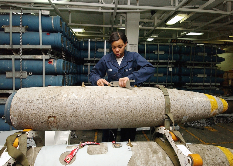 040429-N-1082Z-116  Arabian Gulf (April 29, 2004) ñ Aviation Ordnanceman Airman Lauren Carr of Atlanta, puts a switch on a 2,000 lb. MK-84 general-purpose bomb in a weapons magazine aboard USS George Washington (CVN 73).  The Norfolk, Va.ñ based nuclear powered aircraft carrier is on a scheduled deployment in support of Operation Iraqi Freedom (OIF). Official U. S. Navy photo by Photographerís Mate Airman Jason R. Zalasky.