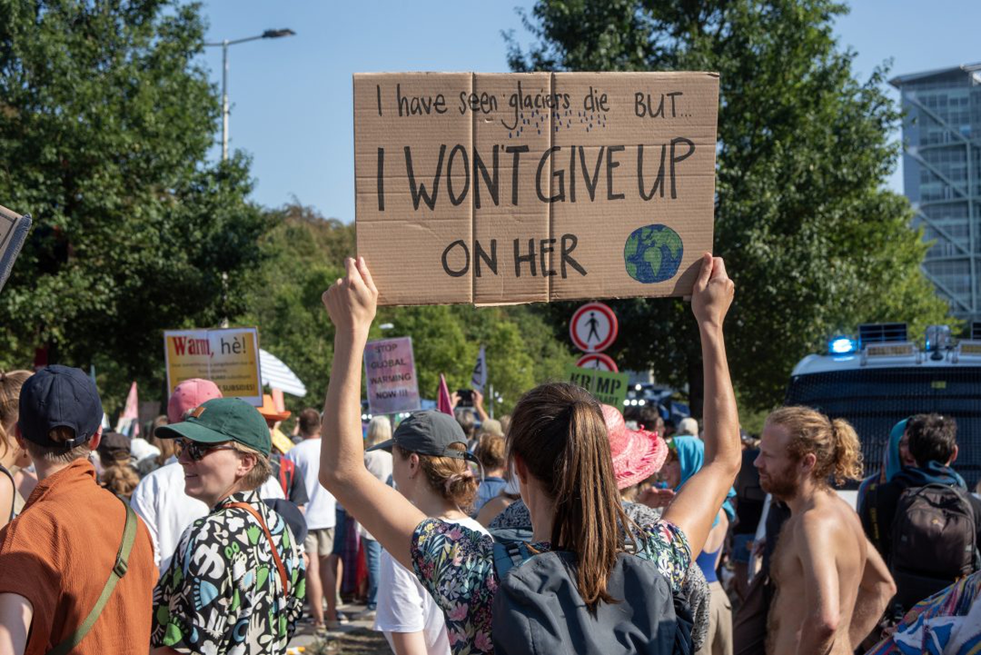 A female protester holds her placard to express her opinion