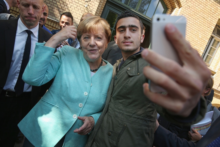 angela merkel refugee shelter selfie