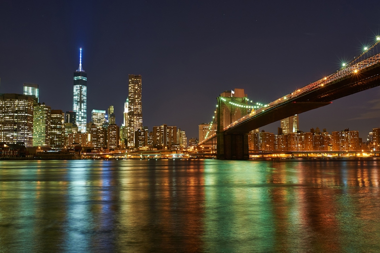 Brooklyn Bridge with lower Manhattan skyline at night