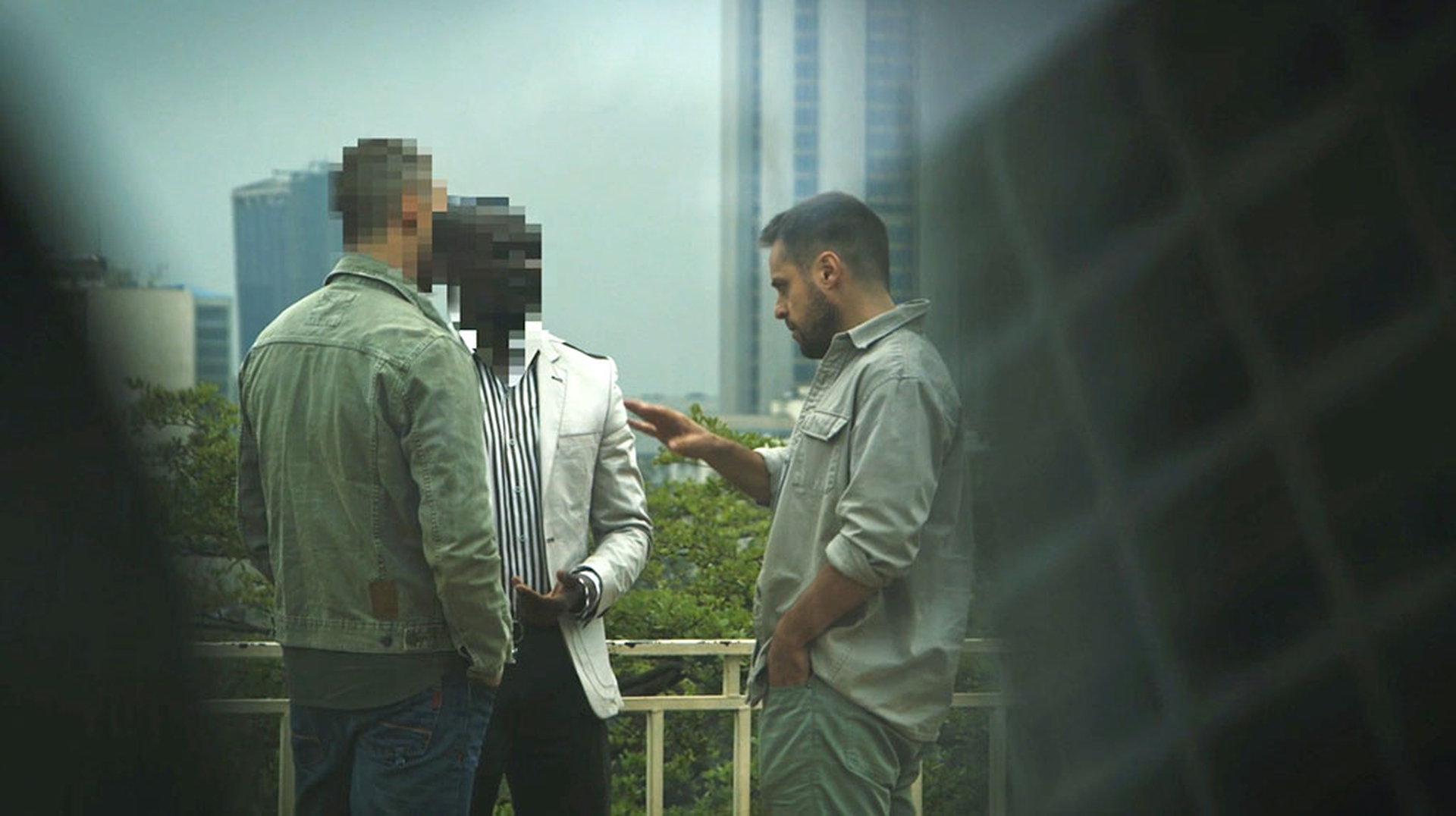 Andrea Crosta with two informants