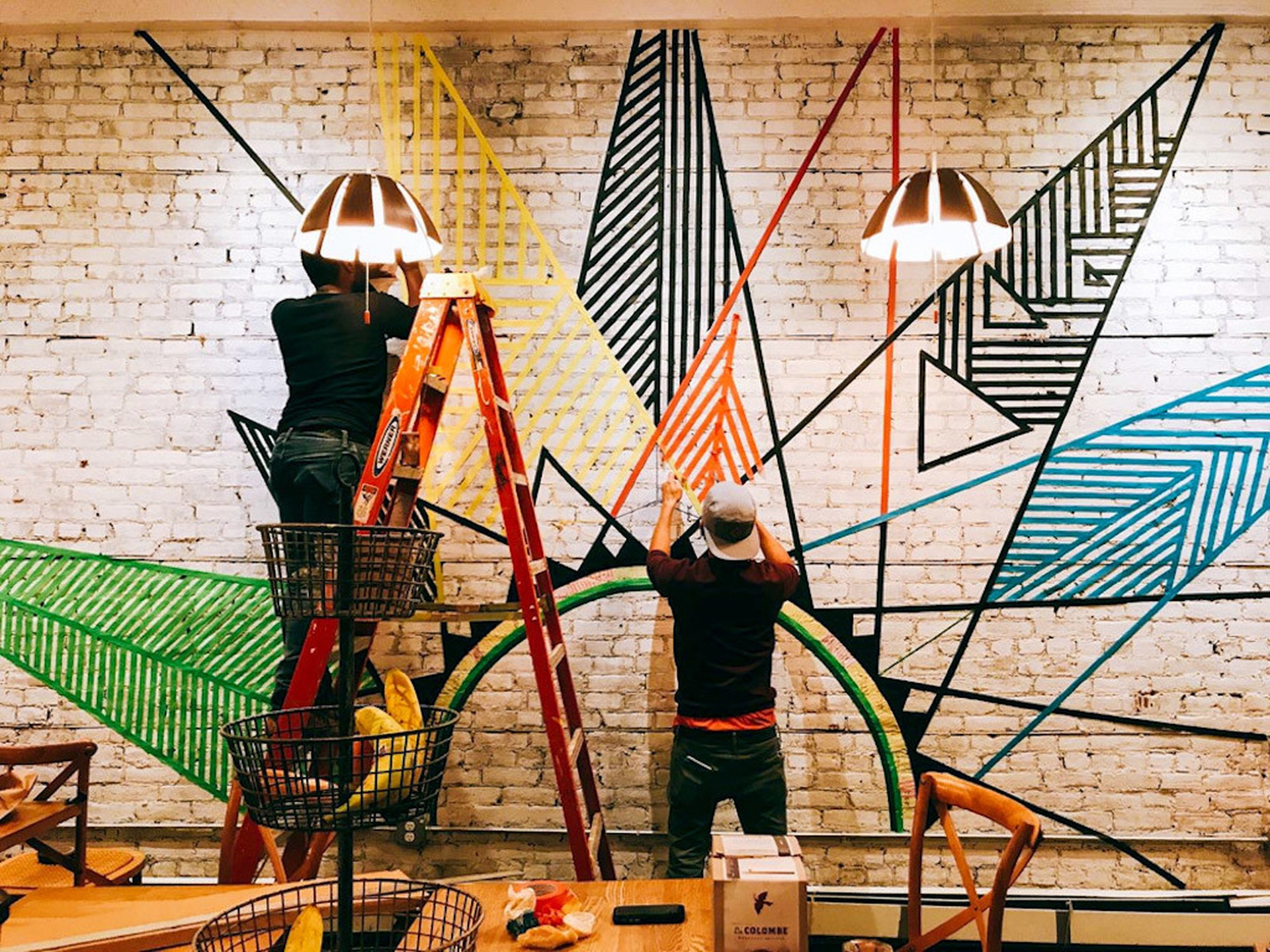 Artists working on a mural in Hoboken for the bicentenary of Bahá’u’lláh's birth