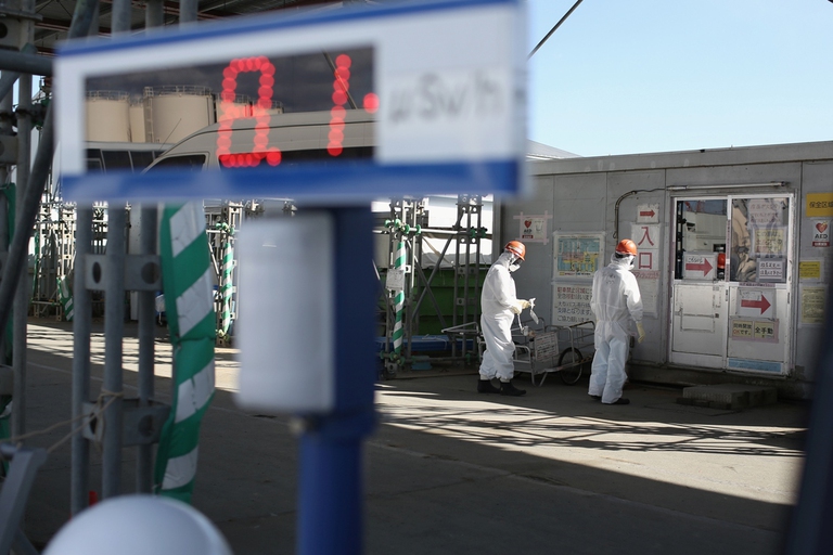 Workers monitor radiation at the Fukushima Daiichi Nuclear Power Plant