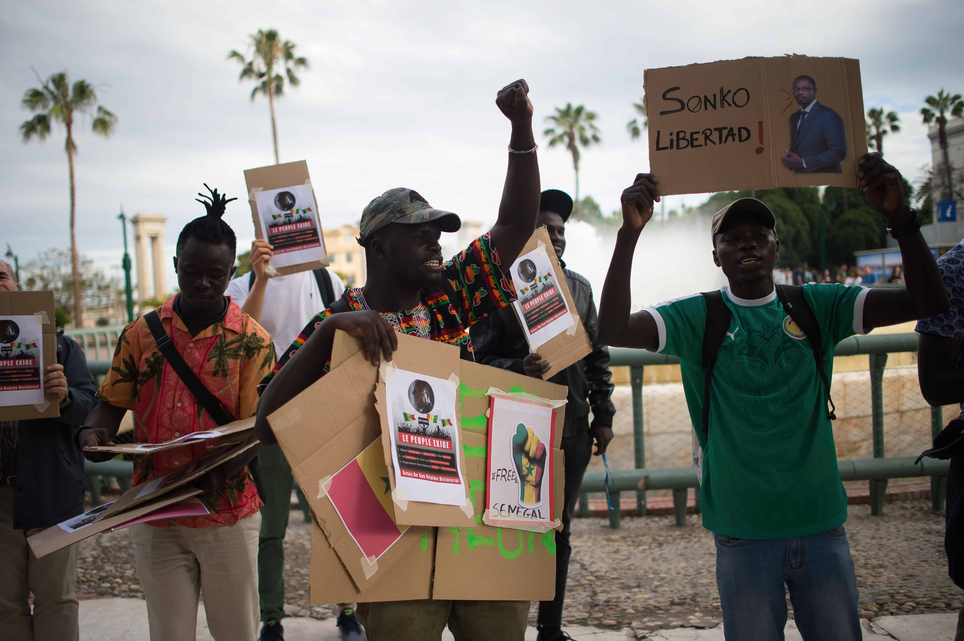 A protester is seen raising his fist during a protest