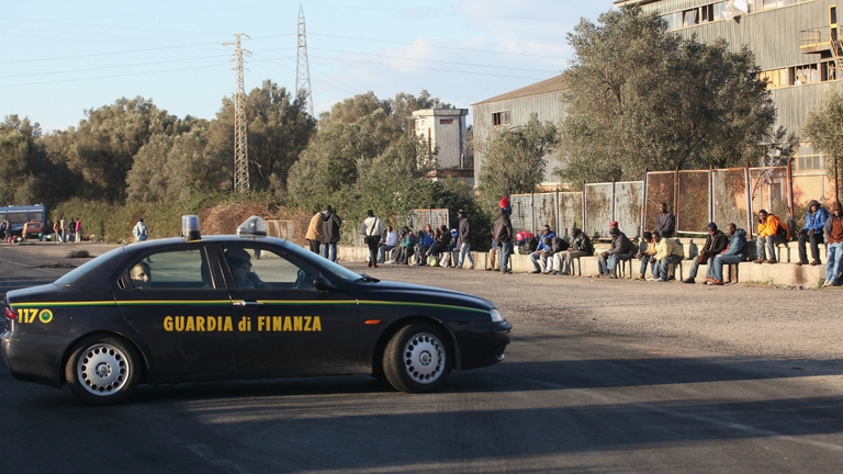 Migrant are brought by bus to Crotone after two recent incidents which have left four Africans injured, January 09, 2010 in Rosarno, Italy. Racial unrest continues in the southern Italian town after two Africans were shot and wounded during rioting. A previous drive-by shooting, which also injured two other African immigrants, sparked the riot. Both incidents happened by a unoccupied factory where African workers have been living.