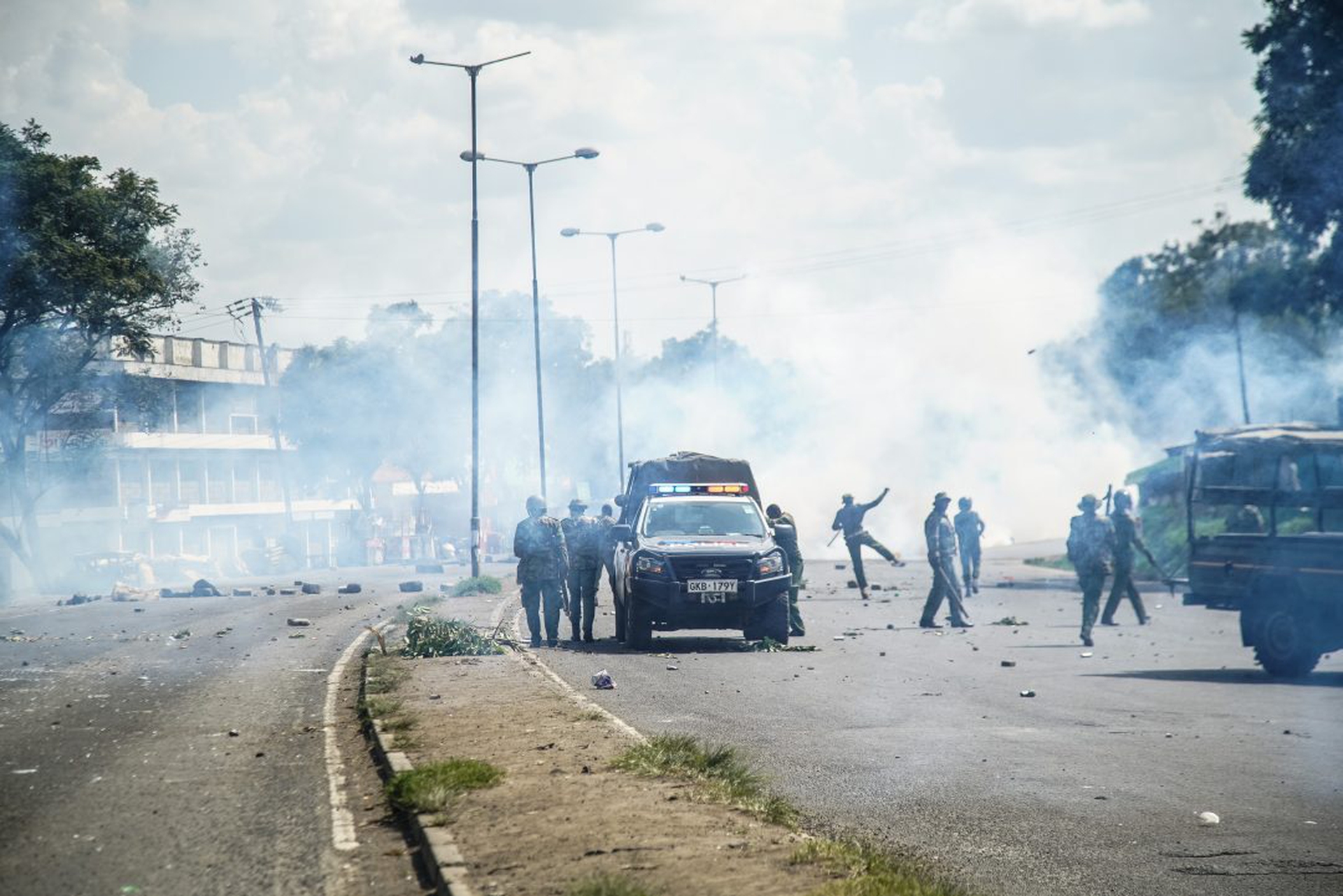 Anti-riot police use teargas to disperse protesters who had
