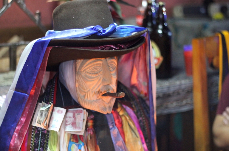 Maximón is a Mayan folk saint who's fond of smoking cigars and likes money © Sarine Arslanian