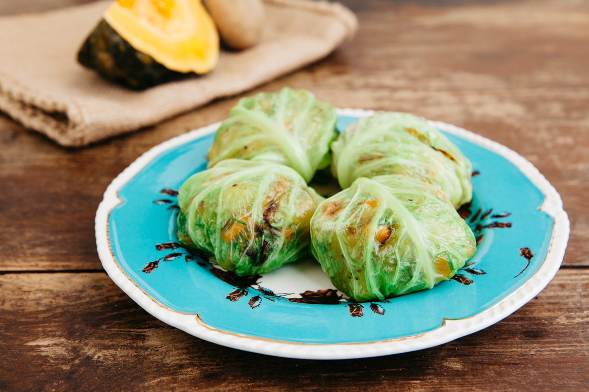Savoy cabbage rolls filled with potatoes and pumpkin