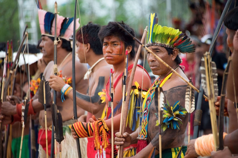 Indigenous men of various tribes wait to take part in the bow and arrow competition during the XII International Games of Indigenous Peoples in Cuiaba, Mato Grosso state, Brazil on November 12, 2013. 1500 natives from 49 Brazilian ethnic groups and from another 17 countries are gathering in Cuiaba until November 16 to compete in some 30 athletic disciplines, many of their own. (Christophe Simon/Getty Images)