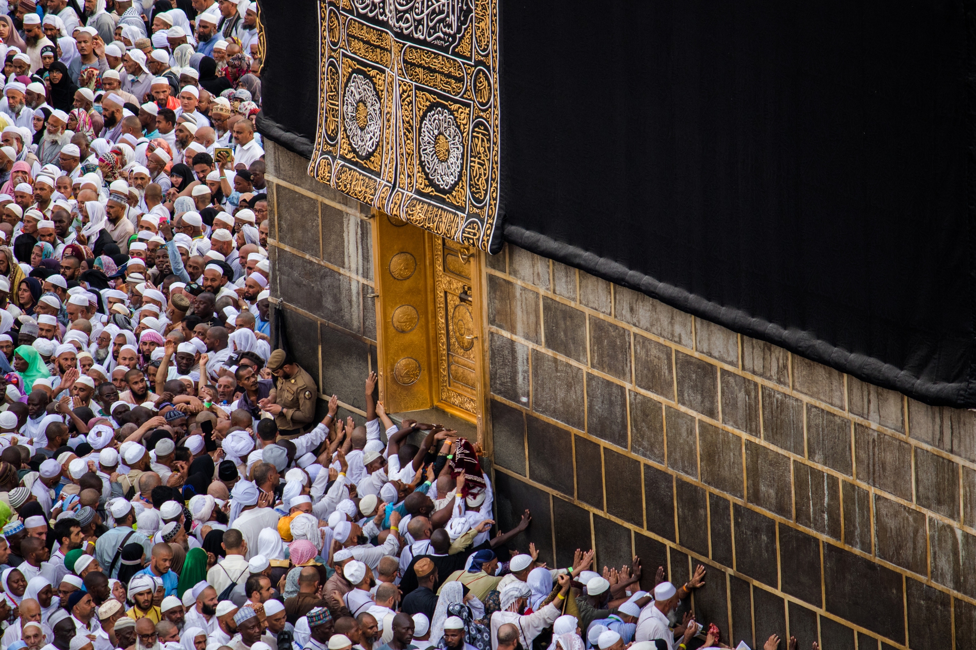 Kaaba. Crowd of people trying to touch the doors of the Holy Kaaba in Masjid Al Haram.