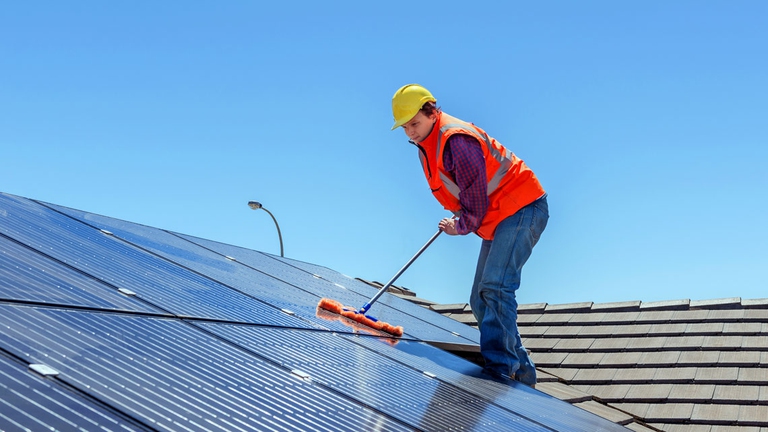 Proper maintenance and cleaning of a photovoltaic system increases its efficiency.  © Ingimage