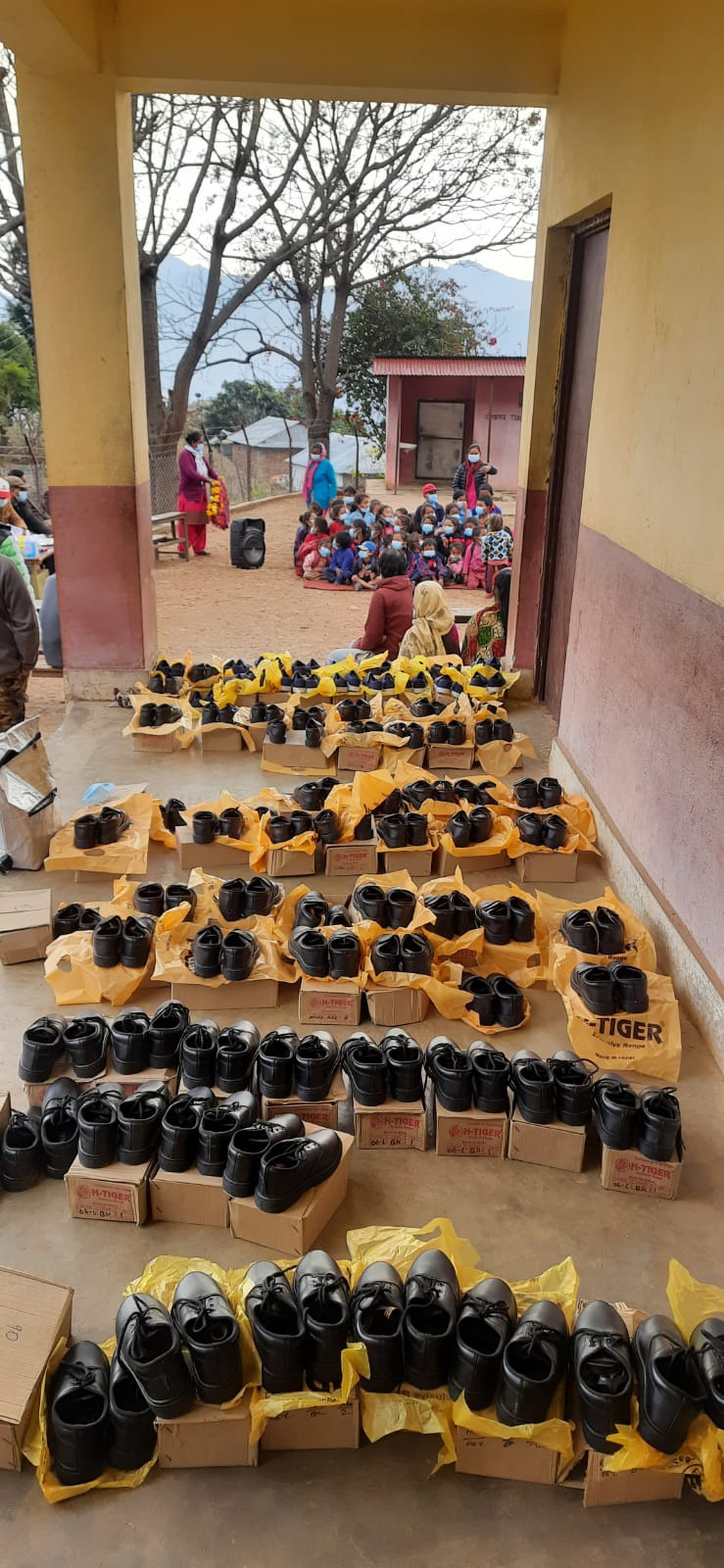 Gokul and Prakriti supplied a school in rural Nepal with various donations, including pairs of shoes for school girls who are forced to walk long distances to school, barefoot, along a stony and often uncomfortable road.