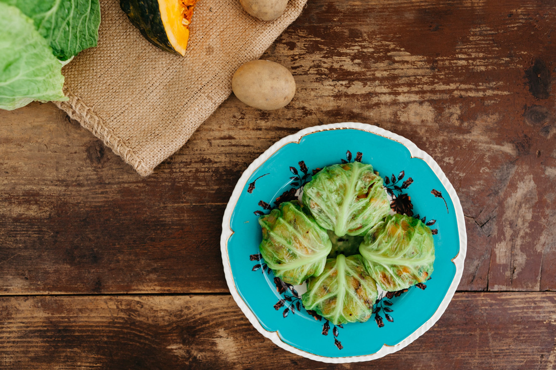 Savoy cabbage rolls filled with potatoes and pumpkin
