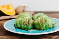 Savoy cabbage rolls stuffed with potatoes and pumpkin