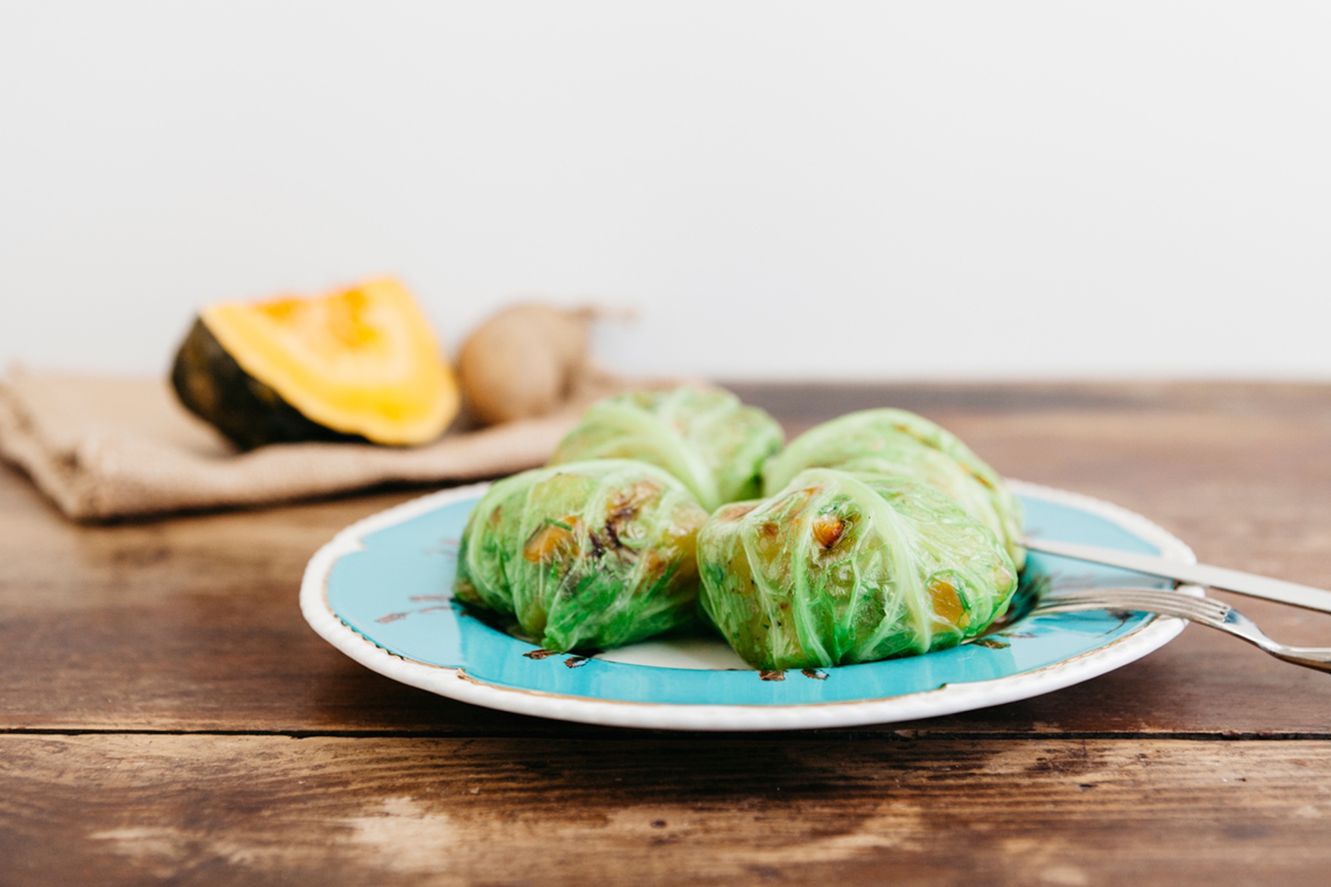 Savoy cabbage rolls filled with potatoes and pumpkin