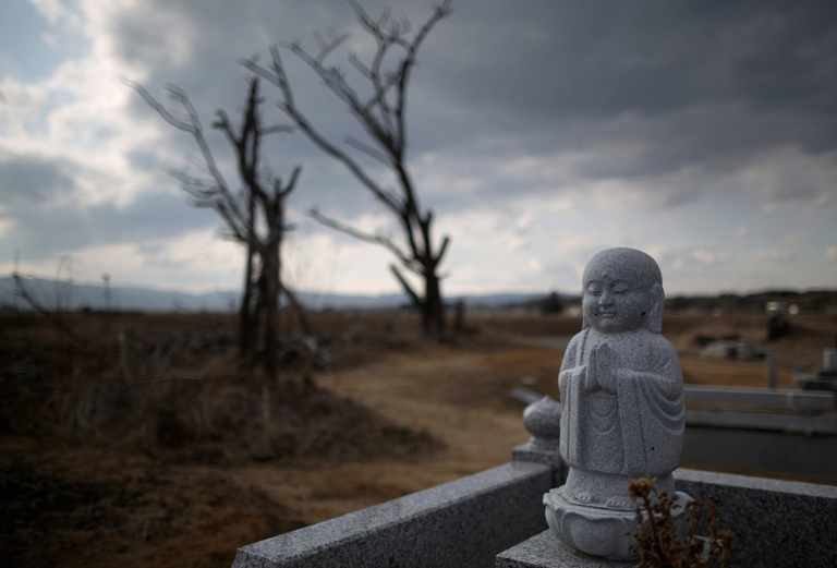 Graveyard in the tsunami scarred landscape near Fukushima, Japan