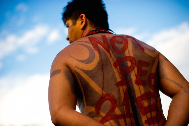 PALMAS, BRAZIL - OCTOBER 26: Brazilian Pataxo Indians with his bodies painted, hold a protest against the proposed amendment to the Brazilian constitution that would change the rules of demarcation of indigenous lands, during  the World Indigenous Games on October 26, 2015 in Palmas, Brazil.  (Photo by Buda Mendes/Getty Images)