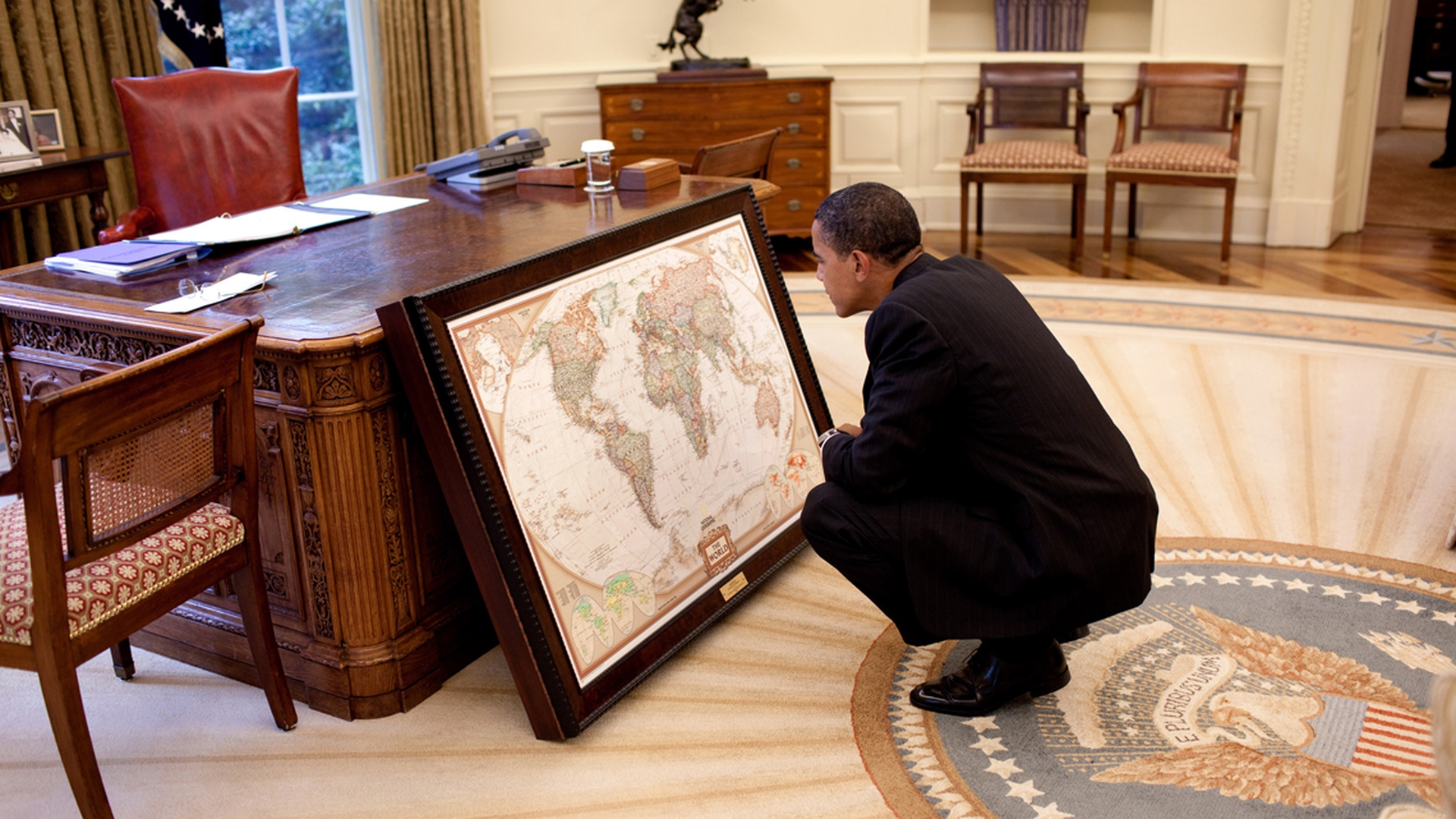 Obama looks at a map donated by the National Geographic society