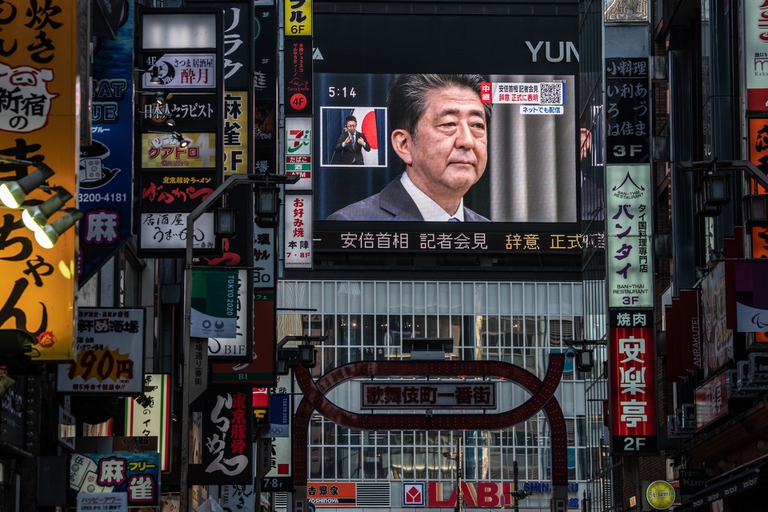 Shinzo Abe's resignation speech on a Tokyo screen