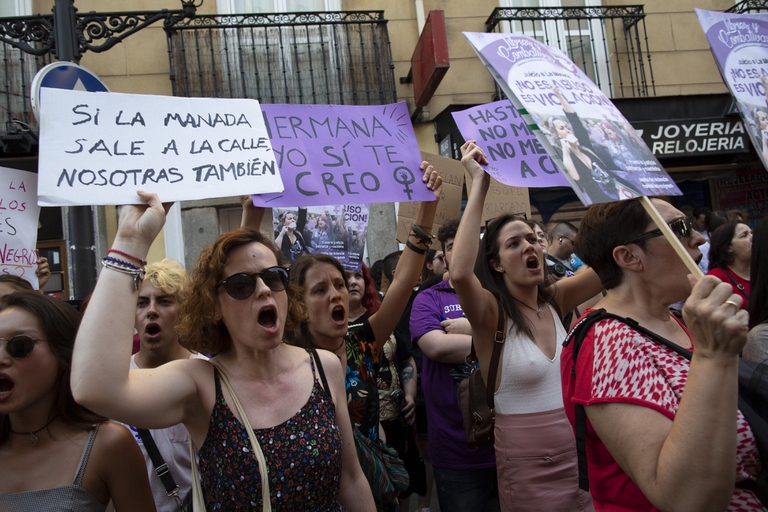 MADRID, SPAIN - JUNE 22: Protesters hold placards reading 'If the wolf pack gang goes out to the street. I do too' and 'Sister I believe on you' during a demonstration against the release of the 'La Manada' (Wolf Pack) gang members outside the Minister of Justice on June 22, 2018 in Madrid, Spain. The High Court of Navarra has ordered their release on bail after nearly two years in provisional prison. The gang assaulted an 18-year-old woman in Pamplona, during the San Fermin Festival in 2016. Feminists and women's rights groups have called for demonstrations across Spain. (Photo by Pablo Blazquez Dominguez/Getty Images)