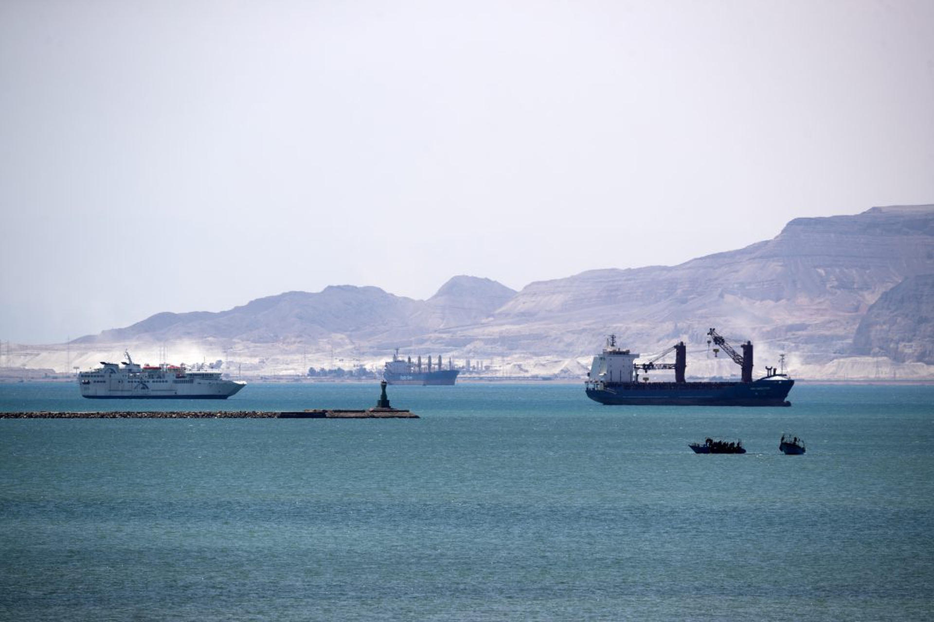 Work Continues To Free Container Ship Stuck In Suez Canal
