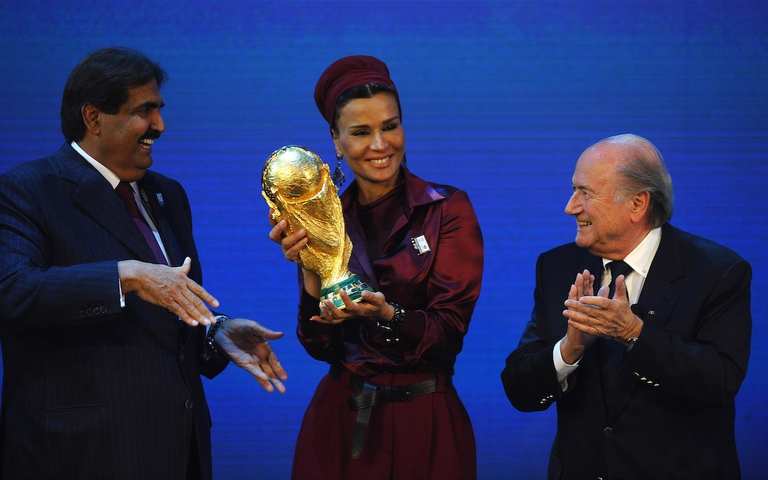 ZURICH, SWITZERLAND - DECEMBER 02: The Emir State of Qatar HH Sheikh Hamad bin Khalifa Al-Thani and Sheikha Mozah bint Nasser Al Missned are presented with the World Cup Tophy by FIFA President Joseph S Blatter after winning the bid for 2022 duirng the FIFA World Cup 2018 & 2022 Host Countries Announcement at the Messe Conference Centre on December 2, 2010 in Zurich, Switzerland.  (Photo by Laurence Griffiths)